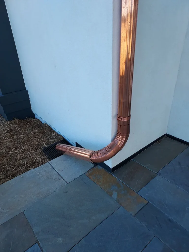 Sheridan Sheet Metal Co. - Copper 4 Round Gutters Corrugated Spout Into Drain