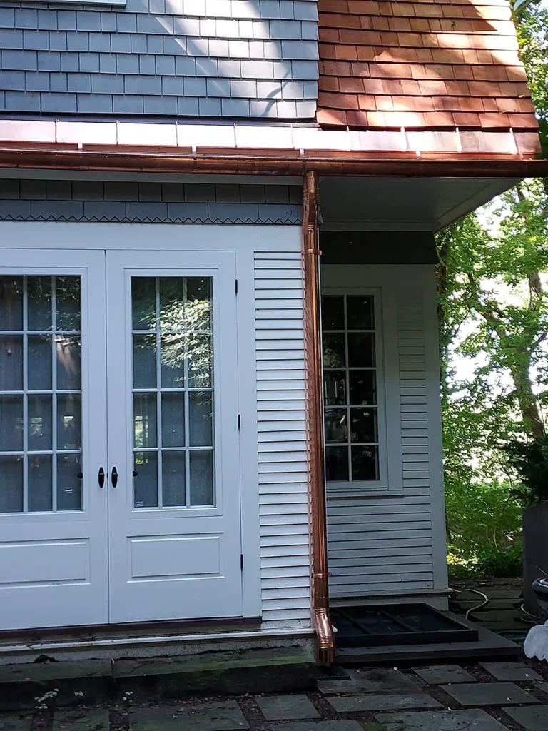 Sheridan Sheet Metal Co. - Copper Half-Round with Accent Roof