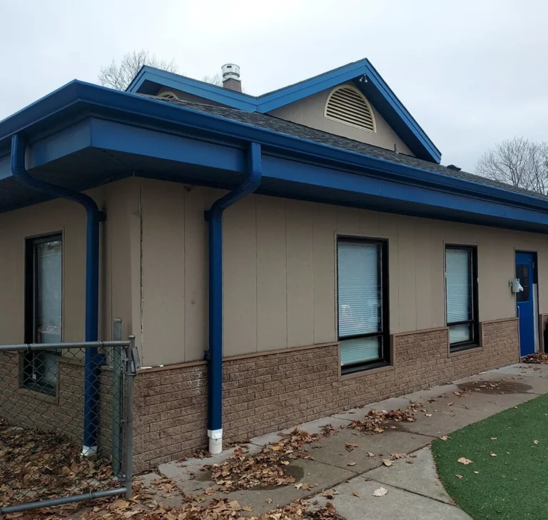 Sheridan Sheet Metal Co. - Blue Commercial Gutters & Downspouts