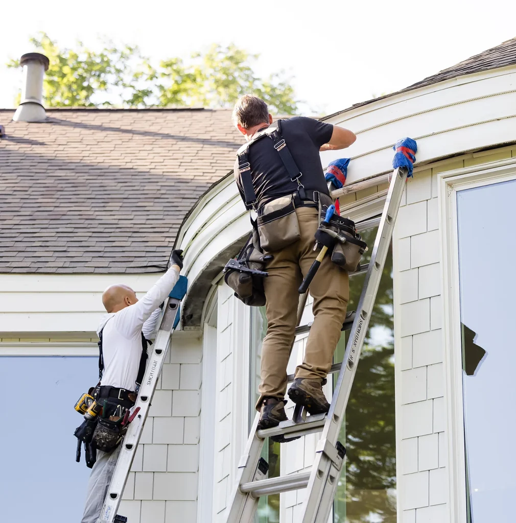 Sheridan Sheet Metal team installing gutters