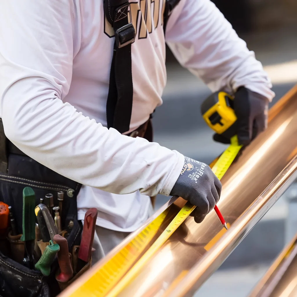 Sheridan Sheet Metal team installing gutters